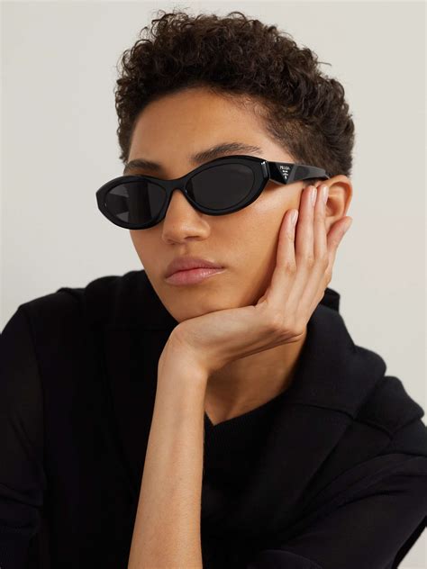 Prada eyewear Oval Frame Sun­glass­es worn by Georgia Steel 